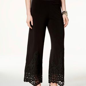 Alfani’s High rise; relaxed fit through hips and thighs; wide